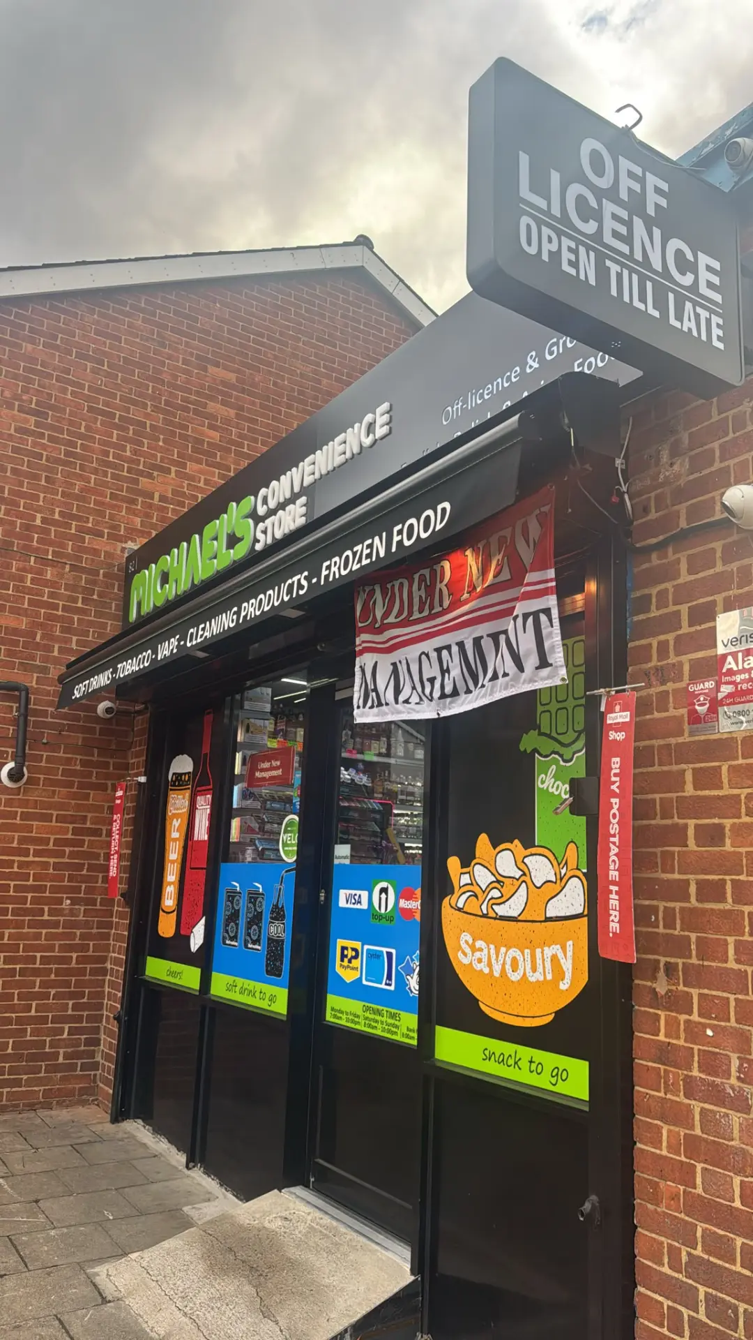 Michael's shopfront with the Off Licence Open Till Late sign